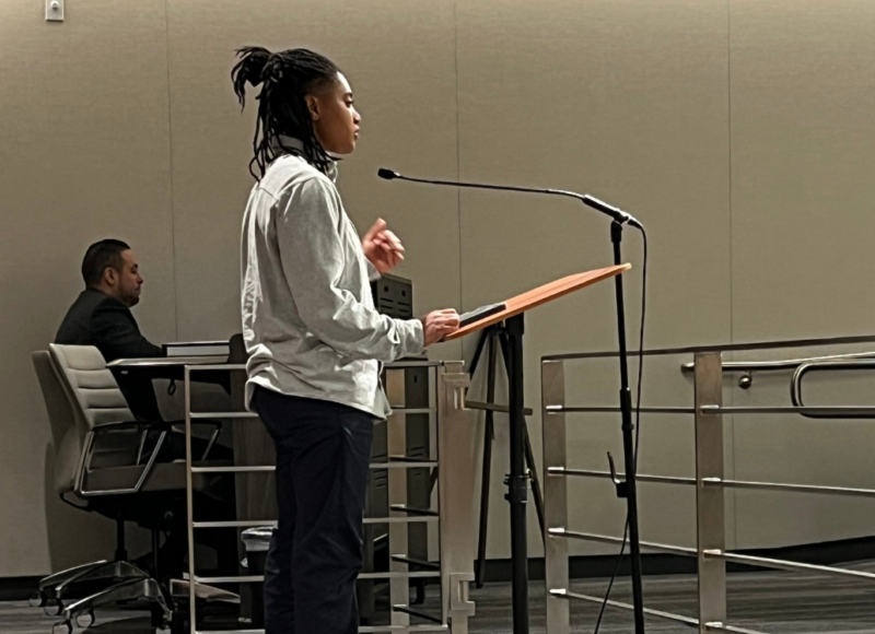 A student standing at a podium.