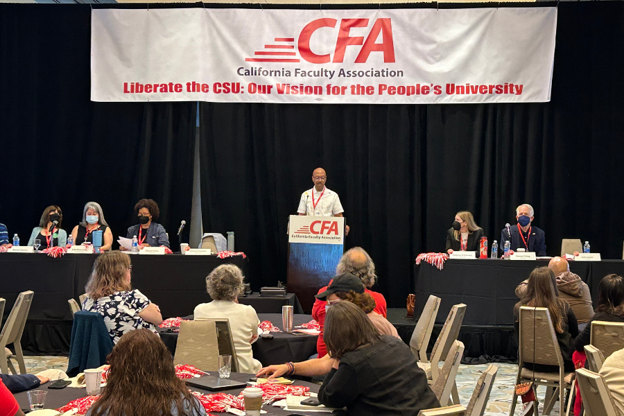 CFA President addresses members from a podium at the Fall Kickoff.