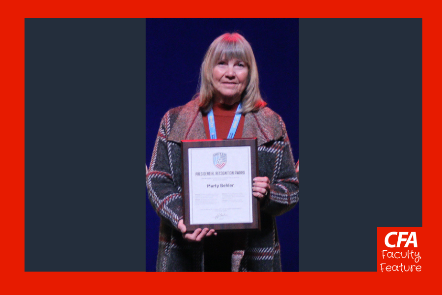 Woman holding an award.