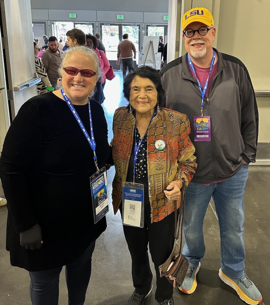 Three people in a hallway