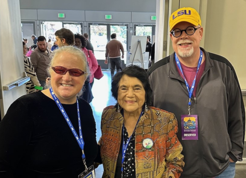 Three people in a hallway